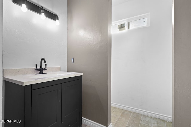 bathroom with wood-type flooring and vanity