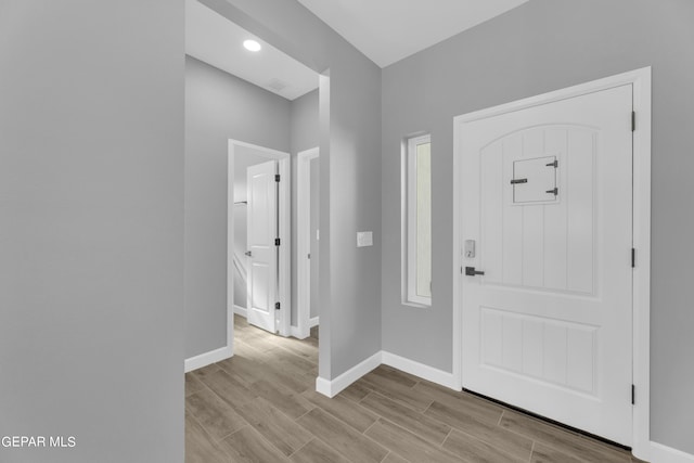 528 Telop Rd, Socorro, TX 79927 - foyer entrance with baseboards, wood tiled floor, and recessed lighting
