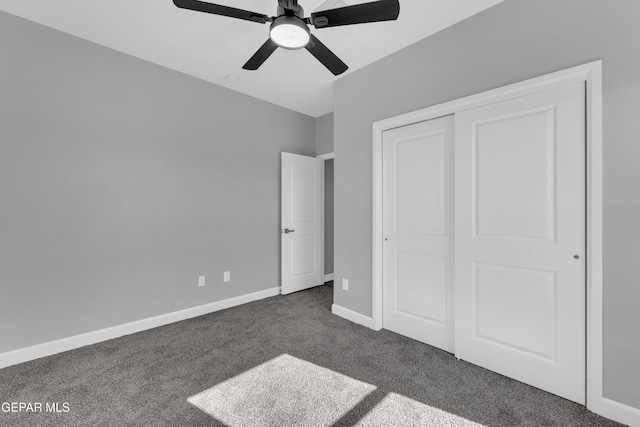 528 Telop Rd, Socorro, TX 79927 - unfurnished bedroom featuring a closet, dark colored carpet, a ceiling fan, and baseboards