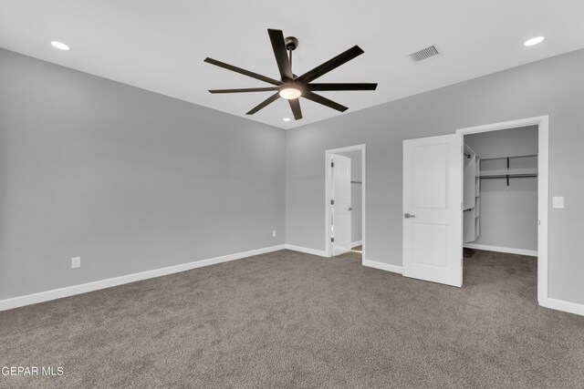 528 Telop Rd, Socorro, TX 79927 - unfurnished bedroom with a spacious closet, dark colored carpet, visible vents, and baseboards