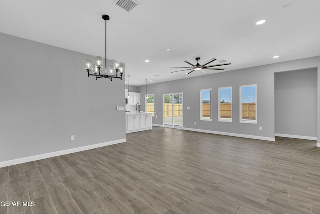 528 Telop Rd, Socorro, TX 79927 - unfurnished living room featuring recessed lighting, visible vents, baseboards, and wood finished floors