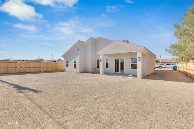 528 Telop Rd, Socorro, TX 79927 - rear view of house featuring a patio, stucco siding, and fence