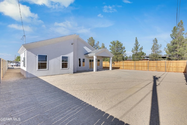 528 Telop Rd, Socorro, TX 79927 - back of property featuring a patio, stucco siding, and fence