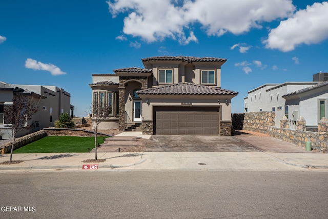 mediterranean / spanish-style house with cooling unit and a garage