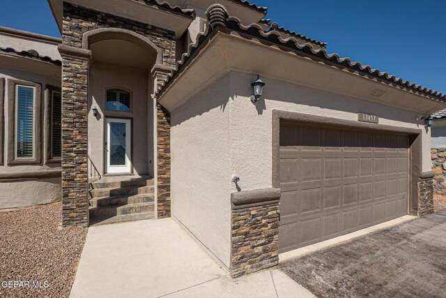 view of side of property with a garage