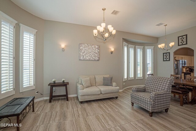 living room featuring a notable chandelier