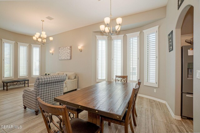 dining room featuring a notable chandelier and a wealth of natural light