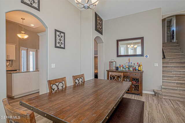 dining room featuring a high ceiling and a notable chandelier