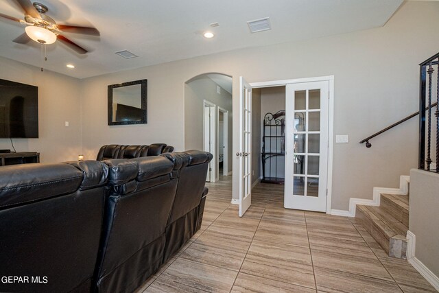 living room with french doors and ceiling fan