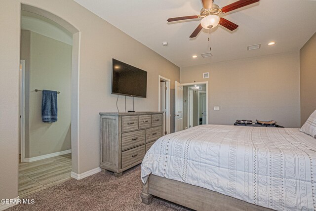 bedroom featuring ceiling fan and carpet