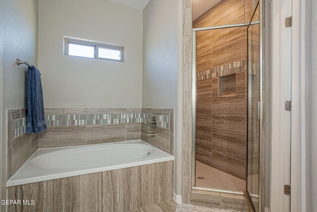 bathroom featuring plus walk in shower