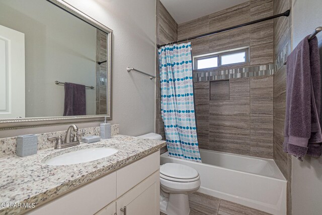 full bathroom featuring vanity, toilet, and shower / tub combo with curtain