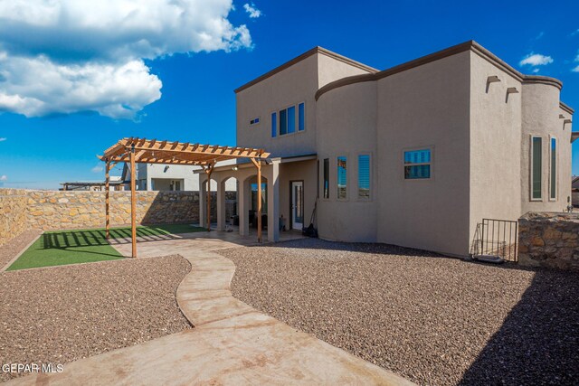 back of house featuring a pergola and a patio