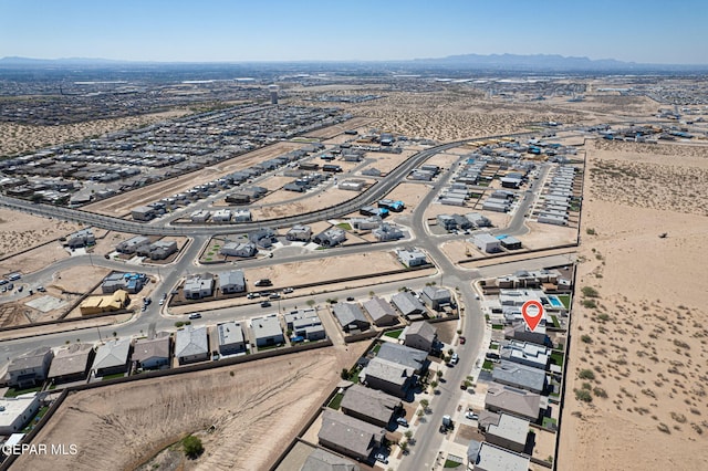 drone / aerial view featuring a mountain view