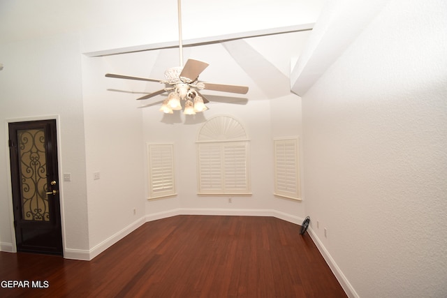 spare room with ceiling fan and dark hardwood / wood-style flooring