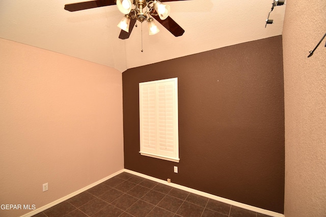 empty room with ceiling fan and a textured ceiling