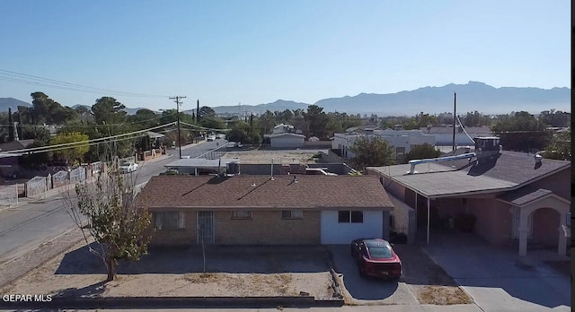 birds eye view of property featuring a mountain view