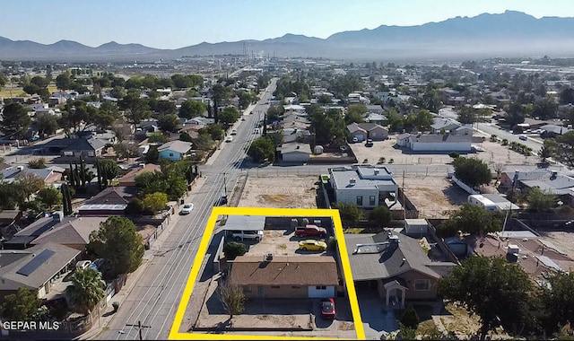 birds eye view of property featuring a mountain view