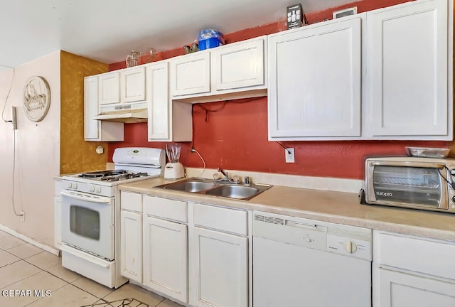 kitchen with white cabinets, sink, light tile patterned floors, and white appliances