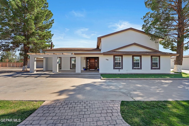 view of front of home featuring a pergola