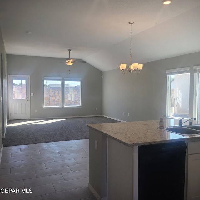 kitchen featuring dark carpet, pendant lighting, dishwasher, and vaulted ceiling