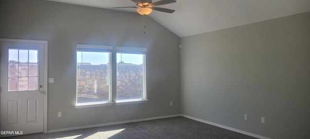 carpeted spare room with ceiling fan, lofted ceiling, and a wealth of natural light