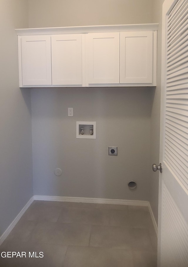 washroom featuring washer hookup, tile patterned floors, cabinets, and electric dryer hookup