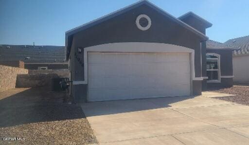 view of side of property with a garage