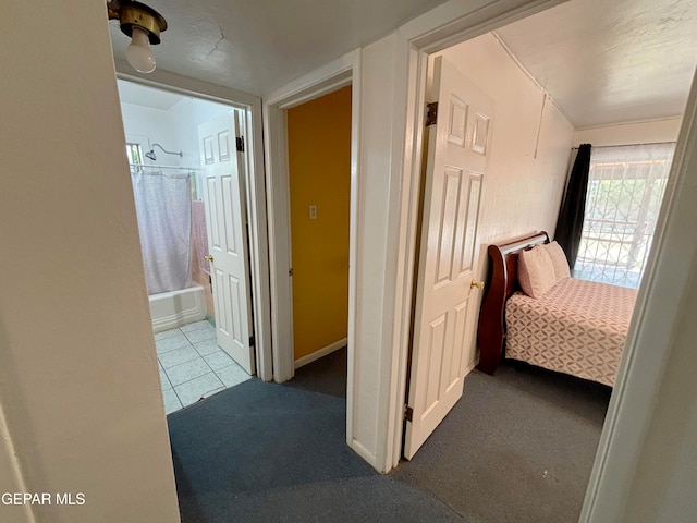 hall featuring light tile patterned floors