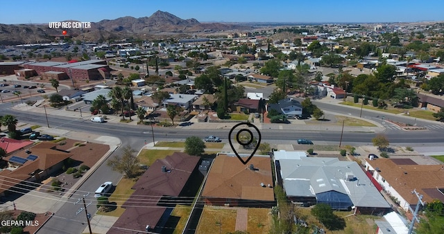 birds eye view of property with a mountain view