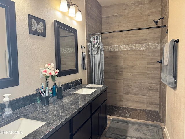 bathroom with vanity and a shower with shower curtain