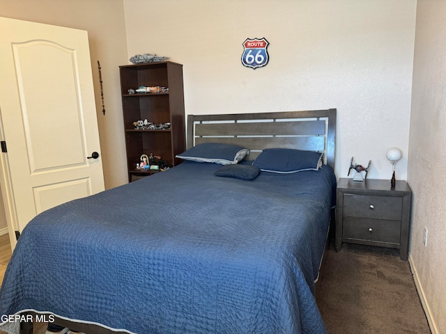 bedroom featuring dark colored carpet