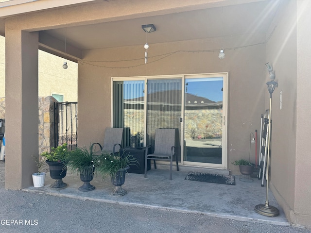 entrance to property with a patio