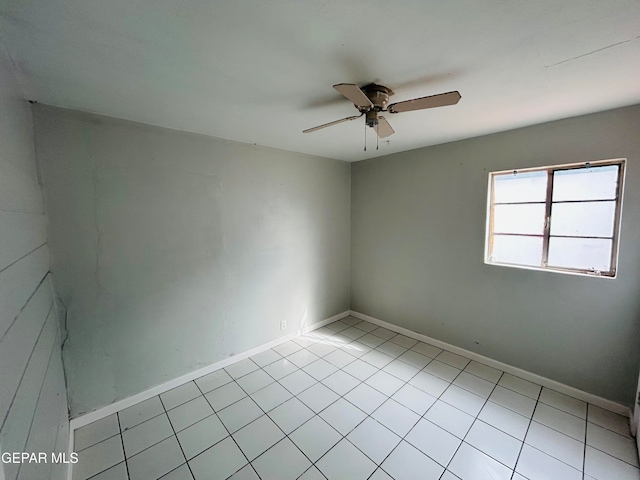 unfurnished room featuring light tile patterned flooring and ceiling fan