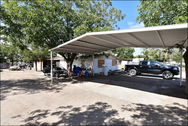 view of parking / parking lot with a carport