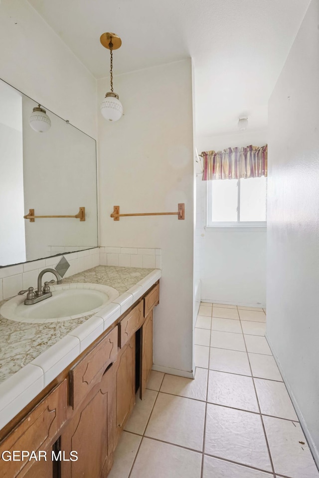 bathroom featuring vanity and tile patterned flooring