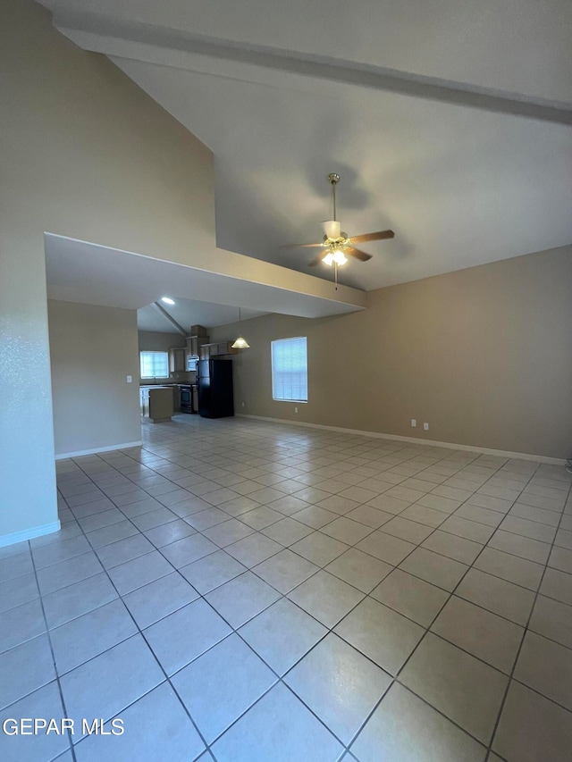 unfurnished living room with ceiling fan, plenty of natural light, and light tile patterned floors