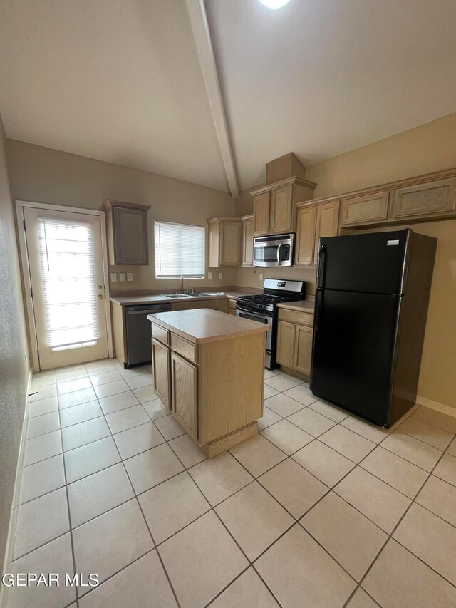 kitchen with lofted ceiling with beams, black appliances, a healthy amount of sunlight, and a center island