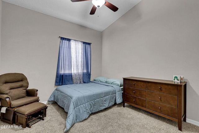 carpeted bedroom featuring lofted ceiling and ceiling fan