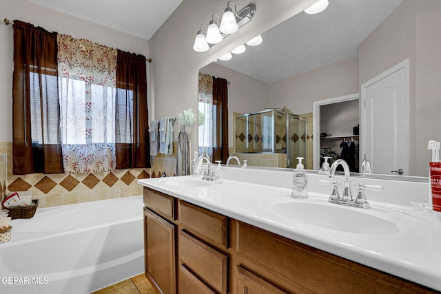 bathroom with vanity, independent shower and bath, and tile patterned floors