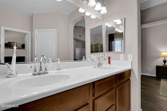 bathroom with vanity and hardwood / wood-style flooring