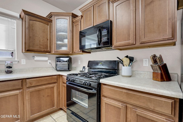 kitchen featuring black appliances and light tile patterned floors