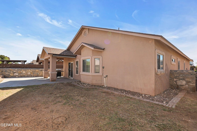 rear view of house with a patio area