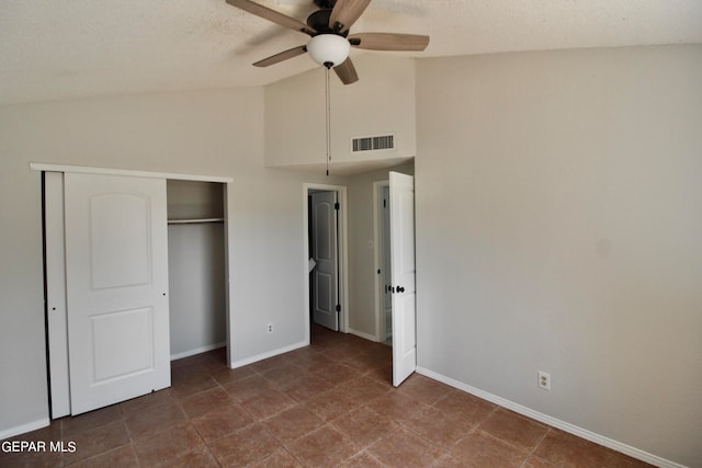 unfurnished bedroom featuring high vaulted ceiling, ceiling fan, a closet, and a textured ceiling