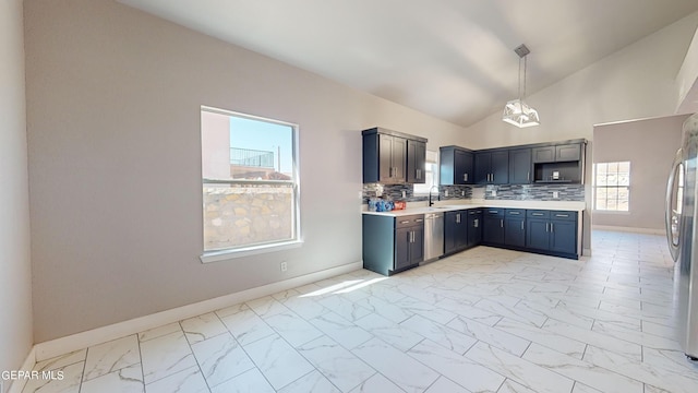 kitchen with stainless steel appliances, backsplash, high vaulted ceiling, and decorative light fixtures