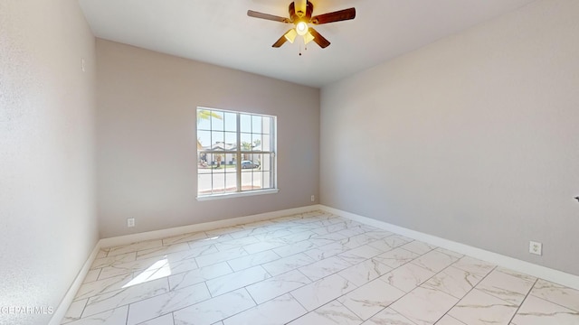 spare room with ceiling fan