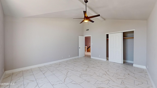 unfurnished bedroom featuring lofted ceiling with beams, ceiling fan, and a closet