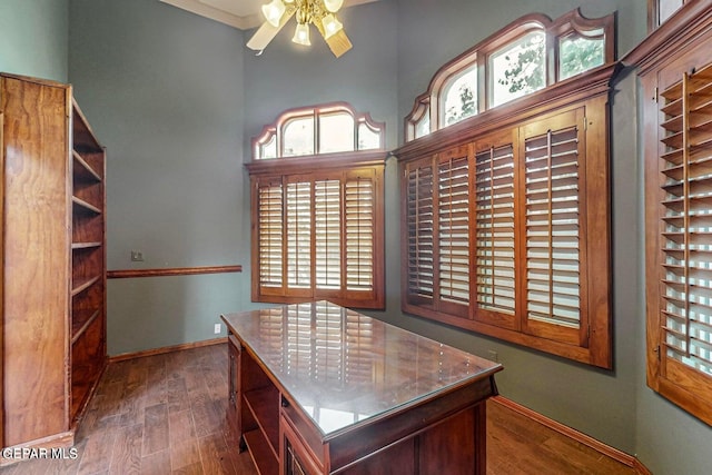 office space with dark wood-type flooring and ceiling fan