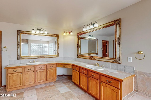 bathroom featuring vanity, a notable chandelier, and tile patterned floors