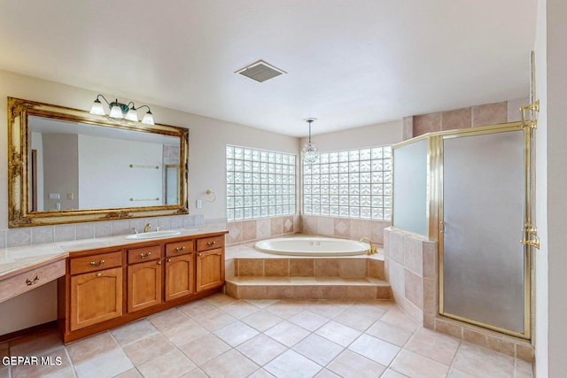 bathroom with vanity, tile patterned floors, and separate shower and tub